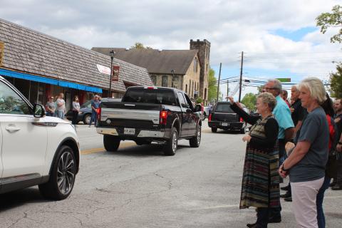Megan Broome/The Clayton Tribune. Reeves Hardware employees were joined by community members in paying their respects and showing their support to the family of Carol Watts Reeves as her funeral procession passed by Reeves Hardware in Clayton Friday, April 24. 