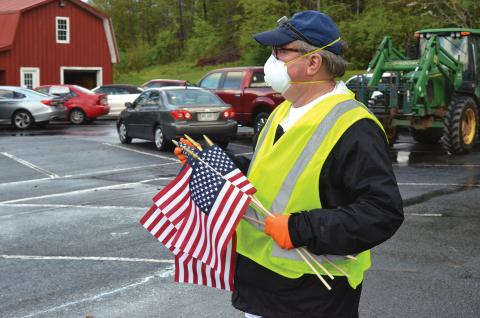 Wayne Knuckles/The Clayton Tribune. Rev. Don Barber, pastor of Rabun Gap Presbyterian Church, oversees preparations for Saturday's food distribution. 