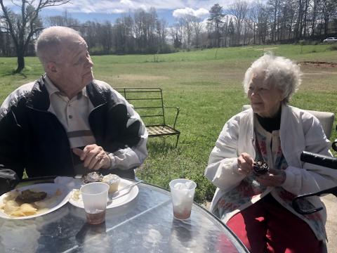 Photo courtesy Traces of Tiger. Ed and Diane Elliott sit outside and eat while spending time talking with each other at Traces of Tiger recently. 