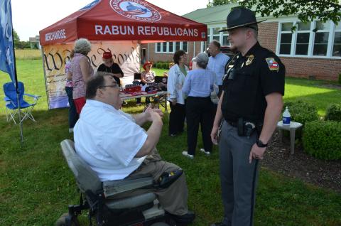 Wayne Knuckles/The Clayton Tribune. Ed Henderson, left, secretary of the Rabun County Republican Party, talks with Dillard Police Chief Jeremy Parker Saturday morning. 