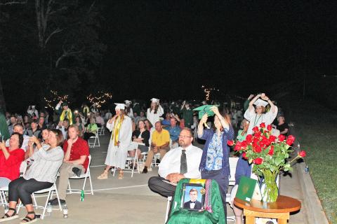 Isaiah Smith/CNI Regional News. An empty chair at graduation ceremonies for Tallulah Falls School Friday marked the loss of Class of 2020 member Stephen Bowman, who died in a drowning accident June 13. 