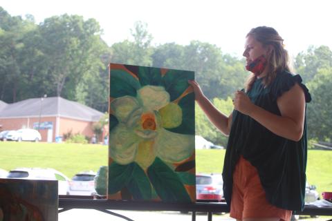Megan Broome/The Clayton Tribune. Sarah Decker, 2020 graduate of Rabun County High School, presents her future plans and discusses the inspiration behind her artwork to the North Georgia Arts Guild at their meeting last Thursday.
