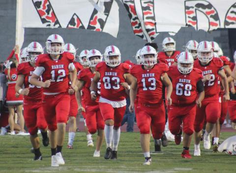 Andy Diffenderfer/The Clayton Tribune. The Wildcats charge onto the field for last Friday’s game with Jefferson at Frank Snyder Memorial Stadium