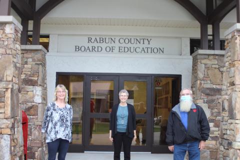 Megan Broome/The Clayton Tribune. Retirees of Rabun County Schools, Judy Burch, 14 years, Becky Cross, 25 years, and Pop Wilburn, 13 years, were recognized at the September Board of Education meeting. 