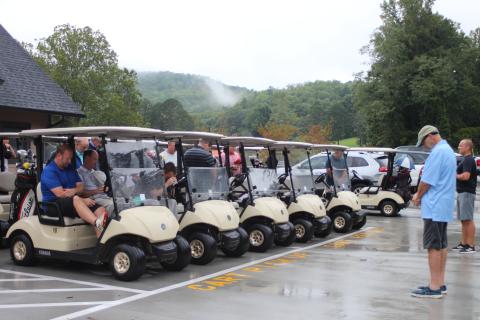 Megan Broome/The Clayton Tribune. Dr. Guy Gober and golf tournament contestants pray before the start of the 16th annual prostate cancer awareness tournament held at the Rabun County Golf Course last Saturday
