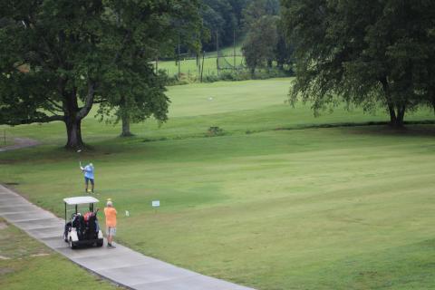 Megan Broome/The Clayton Tribune. Dr. Guy Gober, who organized the 16th annual prostate cancer awareness golf tournament, and partner Perry Thompson join as a team and play a round of golf to participate. 