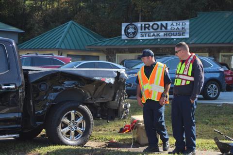 Megan Broome/The Clayton Tribune.Firefighter Hunter Hargrave, left,  and Assistant Fire Chief Justin Upchurch respond to the scene of a five-vehicle accident on Highway 441 at Bo James St. in Clayton on Monday. 