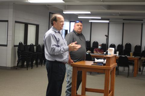 Megan Broome/The Clayton Tribune. Eric Neese, of the engineering company Freese and Nichols, Inc., and Public Works Director Jason Walroup address Clayton council members Tuesday and give an update on the GDOT project to widen Highway 441. 