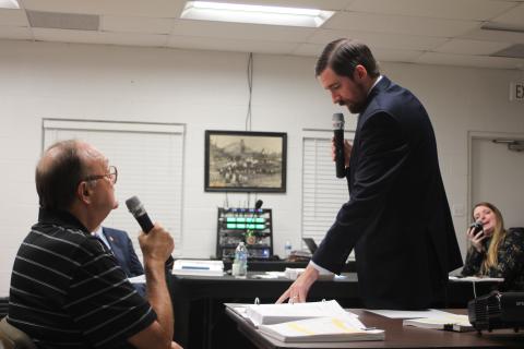 Megan Broome/The Clayton Tribune. David Irvin, left, is questioned by Tallulah Falls Town Attorney Warren Tillery at a hearing earlier this month to determine if J&D Irvin Holdings has a vested right to operate their short-term vacation rental business after a zoning map change. 