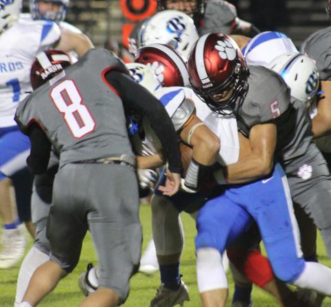 Andy Diffenderfer/The Clayton Tribune A Banks ballcarrier has nowhere to go as Hogan Woodard and Cory Keller combine on the tackle. 