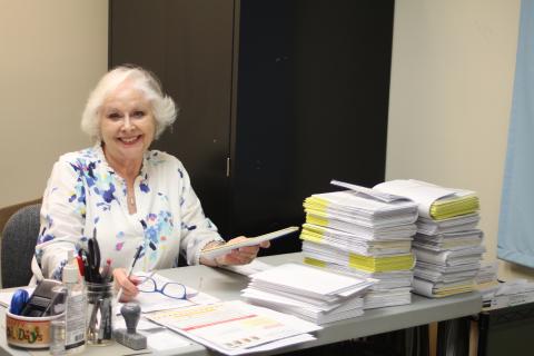 Poll worker Ann D'Agostino processes absentee ballot requests in the Rabun County Board of Elections Office for an election earlier this year.