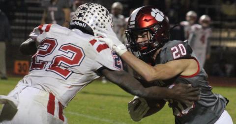 Andy Diffenderfer/The Clayton Tribune Rabun County receiver Sutton Jones battles for more yardage against Haralson County’s Marc Harris. 