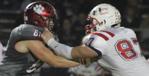 Andy Diffenderfer/The Clayton Tribune Wildcat lineman Will McCraw tangles with Haralson County’s Riley Bell in last Saturday’s Class AA first-round playoff at Frank Snyder Memorial Stadium.