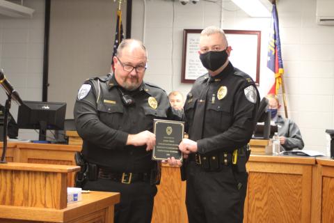 Megan Broome/The Clayton Tribune. Clayton Police Chief Andy Strait congratulates new Assistant Police Chief John Grist. 
