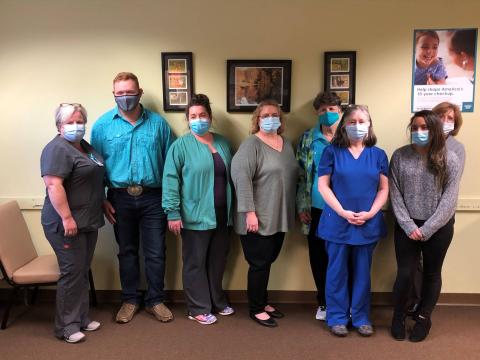 Photo courtesy Rabun County 4-H Club. Rabun County 4-H President Carson Carpenter with members of the Rabun County Health Department.