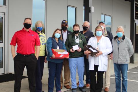 Megan Broome/The Clayton Tribune. The Rotary Club of Clayton distributed gift cards and thank you notes to front-line healthcare workers at Mountain Lakes Medical Center last week. Pictured are Rotarians Tony Penrose, Jane Janes, Alexis Luckett, RN, Rotary President Wayne Knuckles, Paramedic Cole O’Connor, Emergency Department, Rotary president-elect Jef Fincher, Rachel Cowart, Chief Nursing Officer, and Rotarians Matt Mitcham and Ray Pagano. 