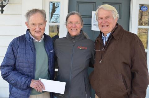 Wayne Knuckles/The Clayton Tribune. Lake Rabun Foundation Executive Director Steve Raeber, left, and Director Emertius Buz Stone, right, present a check for $10,000 to Fight Abuse in the Home (FAITH) Executive Director Caroline Wallis Monday. The contribution put the LRF's total giving to Rabun County at over $2 million. 