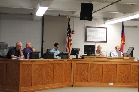 Megan Broome/The Clayton Tribune. Clayton City Council members discuss rezoning the library and other city business at last week's city council work session.