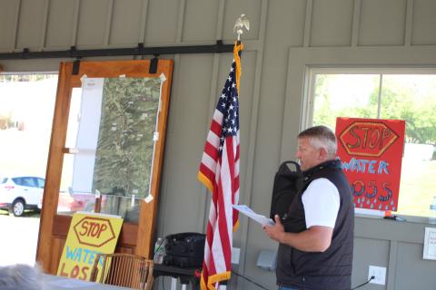 Megan Broome/The Clayton Tribune. Darrin Giles, county administrator, speaks to citizens about the county’s stance on the city’s recent counter-offer to sell their water and sewer system, at a forum hosted by the Rabun County Coalition for Good Government on Monday.