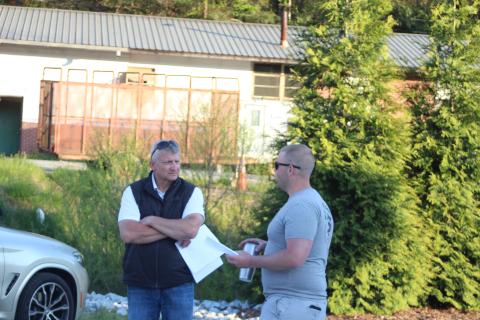 Megan Broome/The Clayton Tribune. County Administrator Darrin Giles and Clayton Mayor Jordan Green converse after a forum about water and sewer consolidation hosted by the RCC4GG on Monday. 