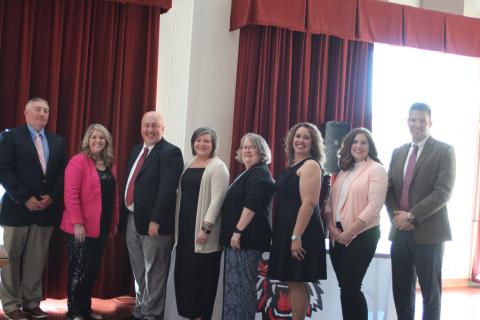 Megan Broome/The Clayton Tribune. Jonathan Welch, RCES Principal, left, Jaimie Crane, RCES and System Teacher of the Year, Jay Fowler, RCPS principal, Lynn Talley, RCPS Teacher of the Year, Kaye Collins, RCMS Teacher of the Year, Kechara Partin, RCMS principal, Alicia McCracken, RCHS Teacher of the Year, and Justin Spillers, RCHS principal, attend a banquet honoring the teachers of the year on April 15. 