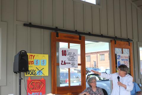 Megan Broome/The Clayton Tribune. Rabun County Coalition for Good Government member Dee Daley (right) points to statistics showing Clayton's water losses are among the 10 worst in Georgia at a public forum last week. Also pictured is Patricia Howell, moderator for the event.