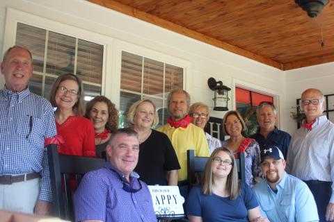 Megan Broome/The Clayton Tribune. Allison McFalls and Daniel Nicholson are the recipients of the Habitat for Humanity of Rabun County 2020 Habitat Home. Front row: Sheriff Chad Nichols, left, Allison McFalls and Daniel Nicholson. Back row: Ed Steil, chair of Building Committee, left, Barbara Anderson, Chair of Fundraising, Jeanine Marlow, Chair of Technology, Susan Smith, Steve Weintraub, Pat Steuck, past president, Cynthia Pagano, Tim Ranney, Chair of Finance, and Don Martin, president. 