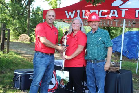 Megan Broome/The Clayton Tribune. Rod Nix from Charles Black Construction, left, hands Rabun County Schools Superintendent April Childers and BOE Chairman Steve Cabe the groundbreaking shovel at the event last Thursday. It marked the start of construction for the RCHS $7 million Agricenter. Charles Black Construction won the bid for the project. The 31 acres of land will be the future home of the Rabun County Future Farmers of America (FFA). 