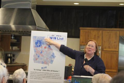 Megan Broome/The Clayton Tribune. Rabun County Democrats hosted guest speaker Melita Easters, executive director and founding chair of the Georgia WIN list, at their monthly meeting held at the Food Bank of Northeast Georgia on Monday. Easters uses charts and maps to discuss and illustrate Georgia’s history of partisan party shifts in districts on a county-by-county basis from 2016 to 2020. 
