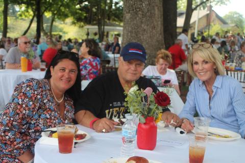 Megan Broome/The Clayton Tribune. Tena Johnson, left, Ron Johnson and Louise Dillard enjoy live entertainment from Chris Blue at The Dillard House on Sunday. 