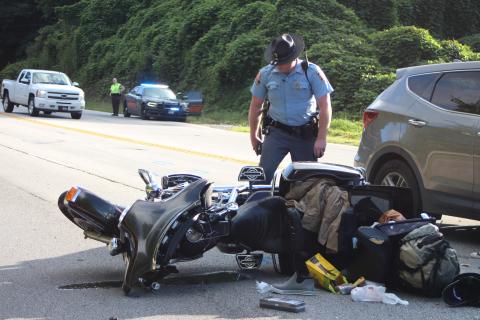 Megan Broome/The Clayton Tribune. A Florida couple was injured following a motorcycle accident at Highway 441 and Cross St. in Mountain City Sept. 2. Georgia State Trooper Brady Galloway works the accident scene. 