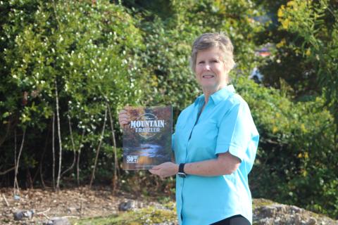 Photo/Megan Broome/The Clayton Tribune. Melissa Elzey of Clayton won $100 for her photo of autumn leaves reflecting on the Tallulah River. Elzey's photo will be featured on the fall edition of The Mountain Traveler magazine, on newsstands now.