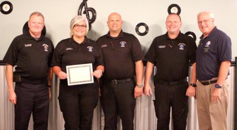 Megan Broome/The Clayton Tribune. Lieutenant Tammy Jones (second from left) is presented with the Rotary Club of Clayton EMS Person of the Year Award at an Oct. 28 Rotary meeting. Also pictured are Mike Carnes, EMS/911 director; Lieutenant Brain Panell (center); Captain Trampes Stancil; and Jef Fincher, Rotary Club of Clayton president. 