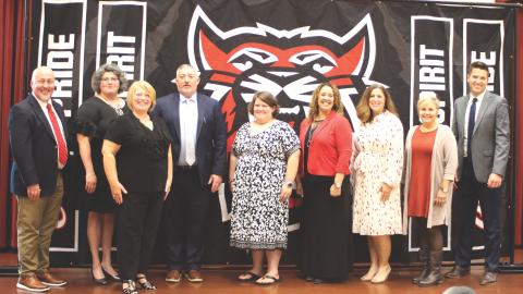 Megan Broome/The Clayton Tribune. RCPS Principal Jay Fowler, left, Laura Welborn, Gretchen Grant, RCES Jonathan Welch, Candace Mathis, RCMS Principal Kechara Partin, Alicia McCracken, Shelley Drummond, and RCHS Principal Justin Spillers.