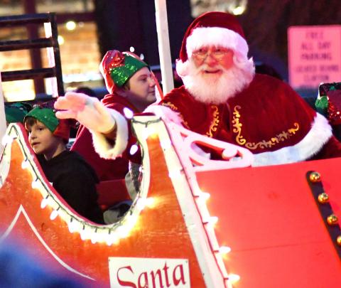 Enoch Autry. Santa waves to all the nice Rabun County children as his lit sleigh rolls down Main Street.