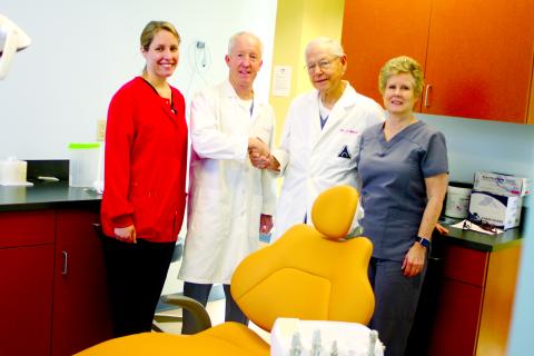 Megan Broome/The Clayton Tribune. he children’s dental clinic at the Rabun County Health Department is back open after being closed due to the COVID-19 pandemic. Kelly Allen, dental hygienist, left, Dr. Brian Davis, Dr. Tom Callahan and Melissa Elzey, assistant/clerk, pose in one of the rooms in the dental clinic. Dr. Tom Callahan is passing the reins to Dr. Brian Davis as the dentist for the clinic. 