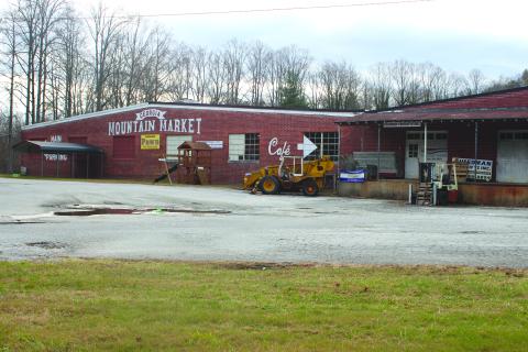 Megan Broome/The Clayton Tribune. MedLink Georgia has bought the Georgia Mountain Market building. The 75,000-square-foot structure with 12 acres currently houses the indoor flea market and other businesses. The building was originally established in 1952 as a factory producing garments. 
