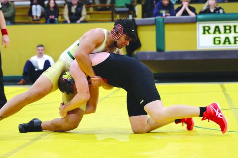 Photo courtesy of Rabun Gap-Nacoochee School. Joaquin Acuna, left, wrestles for Rabun Gap on Jan. 7 during the team’s home opener. The Eagles defeated Southlake Christian and Wesleyan Christian School. 