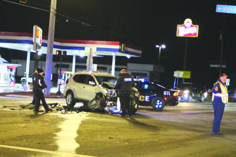 Megan Broome/The Clayton Tribune. Officials investigate one of the three vehicles involved in a Jan. 20 crash on Ga. 15 in Clayton.