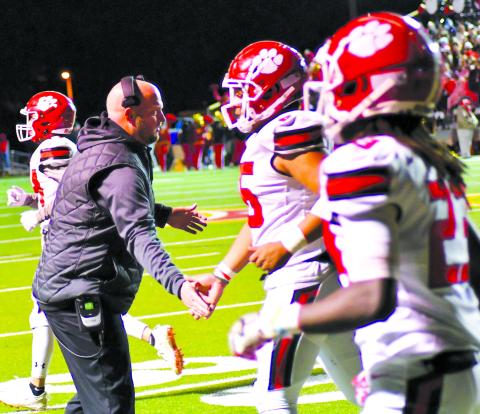 Enoch Autry/The Clayton Tribune. Jaybo Shaw applauds his Wildcat players’ effort during Shaw’s last game as RCHS head football coach in Thomasville in the Class AA state quarterfinals. The Wayne County school board approved Shaw as the Class 5A Jackets’ new head football coach and assistant athletic director. Shaw, who also served as the RCHS athletic director, will start in Jesup on Jan. 17.