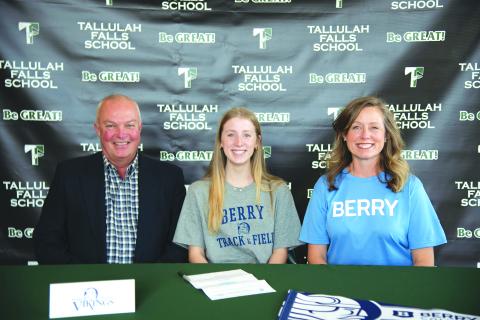 Photo courtesy Austin Poffenberger. Seated with her parents, Macy Murdock of Tallulah Falls signs her letter of intent on Jan. 13 to compete in track and field with Berry College.