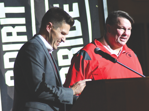 Enoch Autry/The Clayton Tribune. RCHS Principal Justin Spillers, left, introduces Michael Davis as the new head football coach at RCHS Thursday. Davis served as the Offensive Coordinator and Quarterbacks Coach for the Wildcats in 2021.