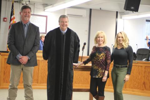 Megan Broome/The Clayton Tribune. Clayton candidates for mayor and council member positions elected Nov. 2 were sworn-in to office Monday by Probate Judge Carlton H. Jones III. Mayor Kurt Cannon, left, Probate Judge Carlton H. Jones III, Council Member Althea Bleckley and Council Member Amanda Harrold pose for photographs following the ceremony. 