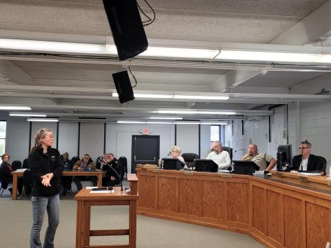 Megan Broome/The Clayton Tribune. Nicole Hayler, executive director of Chattooga Conservancy, addressed council members about a blocked culvert that channels Stekoa Creek under Chechero Street.