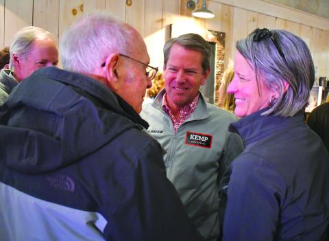 Enoch Autry/The Clayton Tribune. Gov. Brian Kemp (center) talks with Rabun County residents Alton Story, left, and Caroline Wallis, executive director of FAITH,during a scheduled meet-and-greet stop at the Clayton Cafe on Main Street.