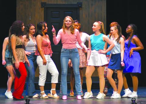 Enoch Autry/The Clayton Tribune. Surrounded by her Delta Nu college sorority, “Elle Woods,” played by Lucy Barry sings during the “Legally Blonde The Musical” performance Thursday at Rabun Gap-Nacoochee School. The musical also will be performed Friday, Feb. 11, and Saturday, Feb. 12.