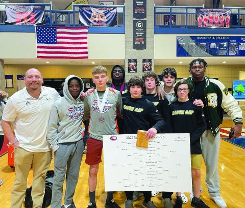 RGNS Atheltics. RGNS head wrestling coach Conor Bozzi (far left) stands with his team at state Benit Namahoro Jabo, Fisher Bejnerowicz, Mike Lengi, Clay Unruh, Cash Unruh, Rocco Toogood, Foster Duquette and Gideon Herbert.