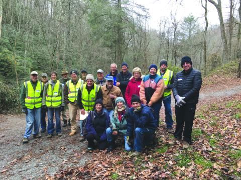 Submitted photo. Sky Valley hemlock treatment crew: Save Georgia’s Hemlocks (SGH) facilitators are in yellow vests. Standing, left to right: Jon Jones, Larry Randolph, Marie Dunkle, Tom Zimmerlink, Pat Hickey, Al Battle, SGH chair and project leader Buz Stone, Jim Curtis, Carl Lynn, Reggie Davis, Howard Beckert, SGH director Donna Shearer, Lena Petersen, Jody Webb and Bruce Gant. Kneeling, left to right: Debbie Davis, Lou MacNaughton and Jon Tiamno. 
