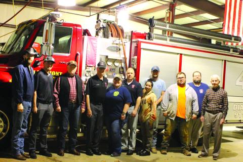 Megan Broome/The Clayton Tribune. Rabun County Fire Services Station 4-Lakemont/Wiley received a donation from the 100 Club of Rabun County during a presentation at Station 4 Monday. Pictured are Firefighters Thomas Plott, left, and Cody Jordan with Charlie Breithaupt of the 100 Club of Rabun County along with Gordon Van Mol, Elisha Higgins, Capt. John Murray, Selena Harvey, Christopher Fairholt, Ti Urpschot, Casey Yarnall, and Denny Webb of the 100 Club of Rabun County. 