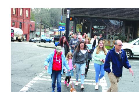Megan Broome/The Clayton Tribune. Community members participate in a Mental Health March hosted by Georgia Mountain Psychological Associates Feb. 22. The march and candlelight service were held to remember those who have lost their lives to mental illness. 